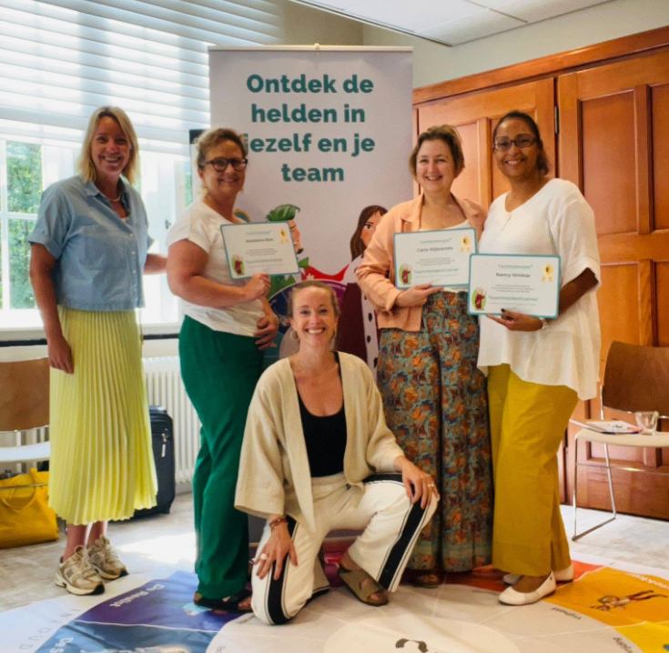 I2I team members celebrating with certificates
